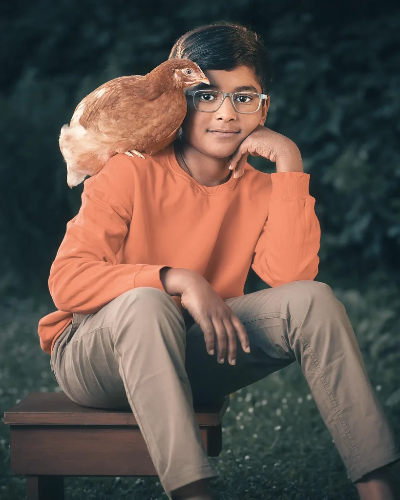 Boy with glasses and a chicken on his shoulder—Christchurch portrait
