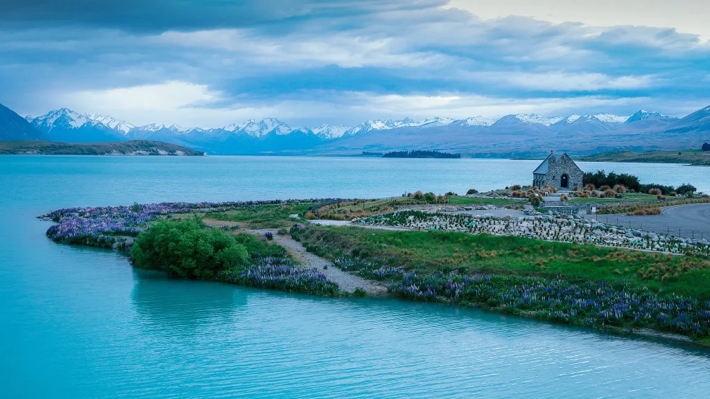 Church of the Good Shepherd with Lake Tekapo and snowy Southern Alps in background